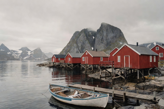 Reine fishing village with red rorbuer cabins in Lofoten Norway